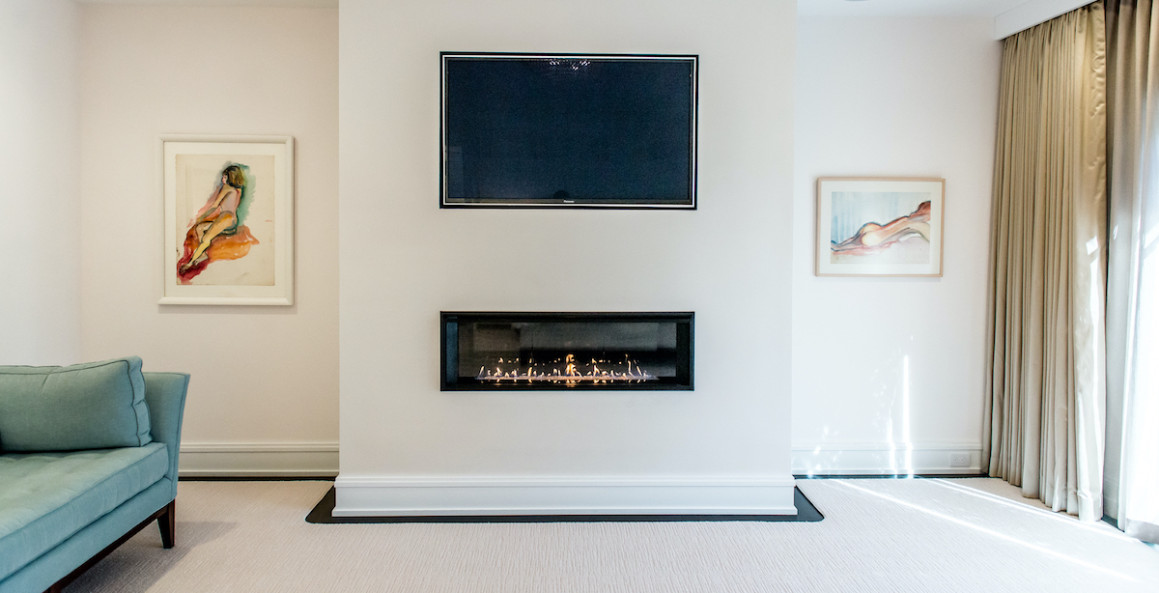 bedroom-fireplace-under-flat-screen-tv