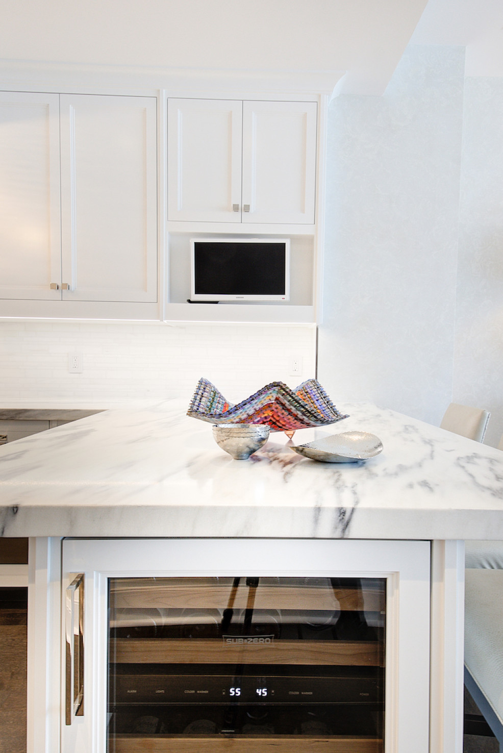 marble-countertop-wine-fridge-white-cabinets